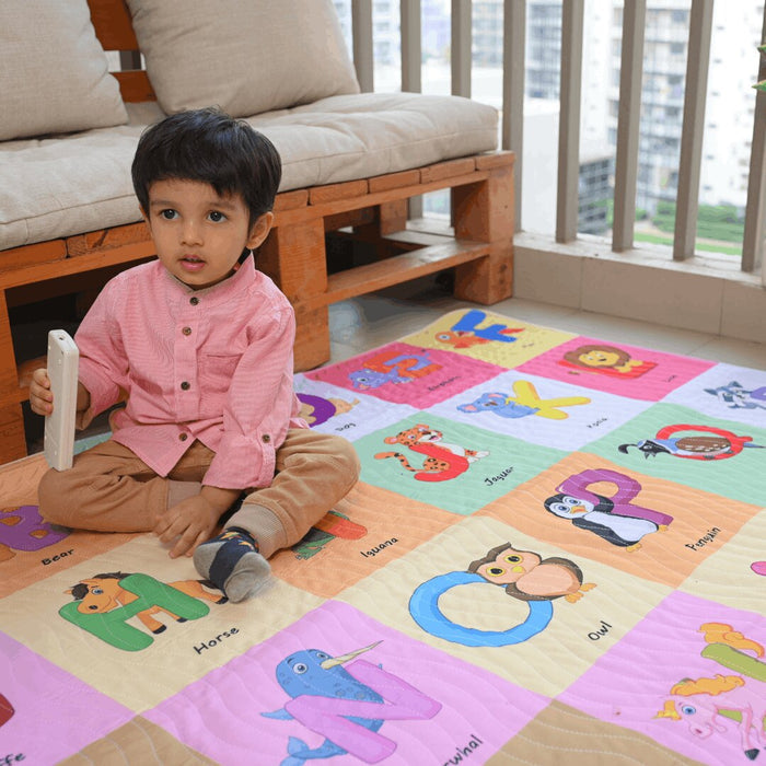 Baby playing on Happy Matty alphabet picnic mat