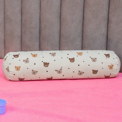 Happy Matty Bear Print Cuddle Bolster Pillow on a Baby Bed