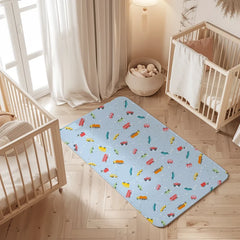 Car print waterproof baby dry sheet laid flat on a bed