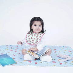 Baby lying on a Happy Matty car print bed protector mat