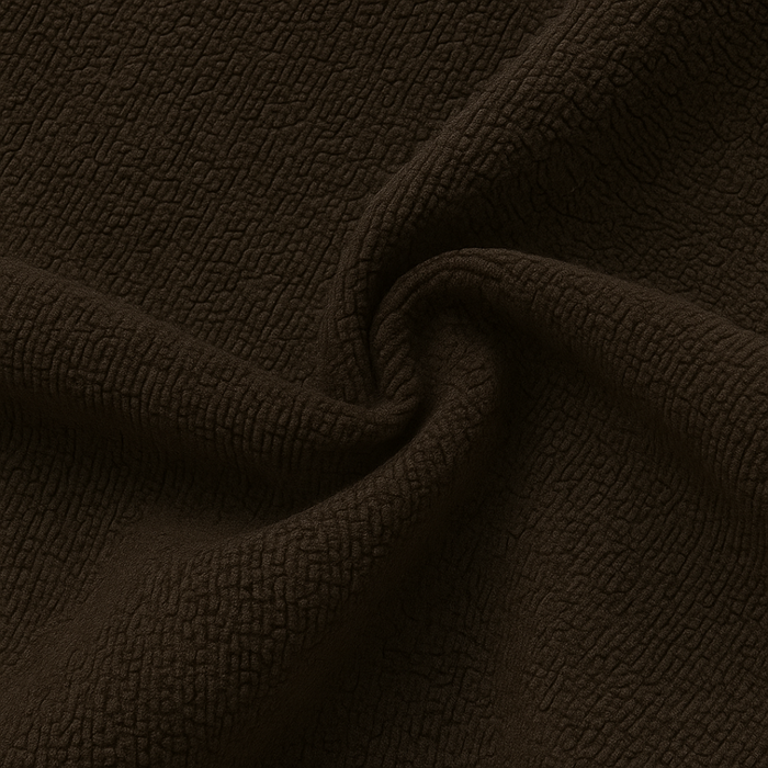 A close-up of dark brown textured fabric with a soft, slightly plush surface, shown draped in gentle folds.