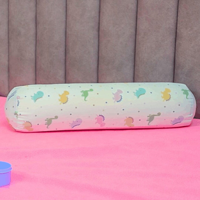 Happy Matty Dinosaur Print Cuddle Bolster Pillow on a Baby Bed