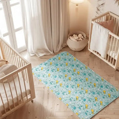 Dinosaur print waterproof baby dry sheet laid flat on a bed