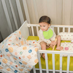 Baby Wrapped in Happy Matty Space Quilt