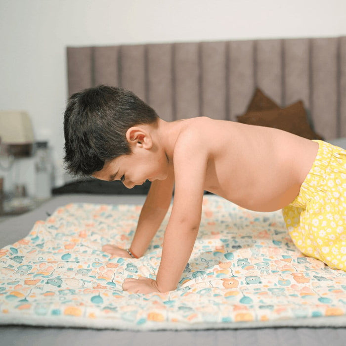 Happy Matty Space Quilt Spread on a Baby Bed