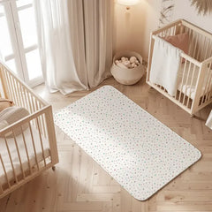 Star print waterproof baby dry sheet laid flat on a bed