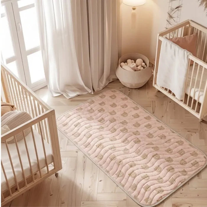 Teddy Bear print waterproof baby dry sheet laid flat on a bed