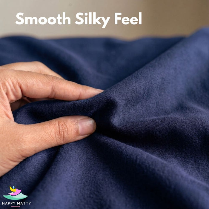 A close-up of a hand stretching and folding a dark navy blue fabric, with the text 'Smooth Silky Feel' at the top and a 'Happy Matty' logo in the bottom-left corner.