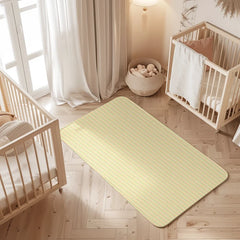 Zigzag print waterproof baby dry sheet laid flat on a bed
